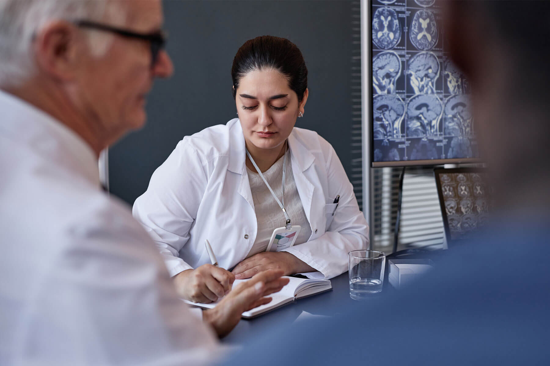 female-neurosurgeon-writing-notes-during-working | mysource-solutions | Health Plans